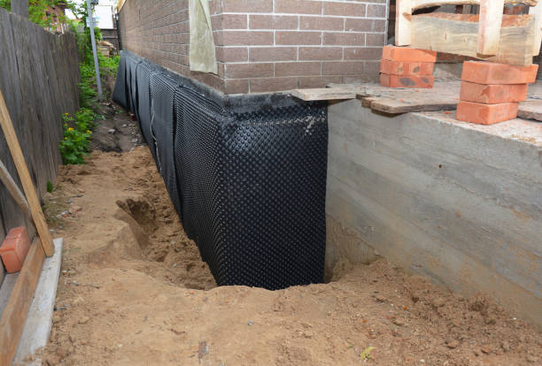 Happy homeowners after waterproofing job in Potwin